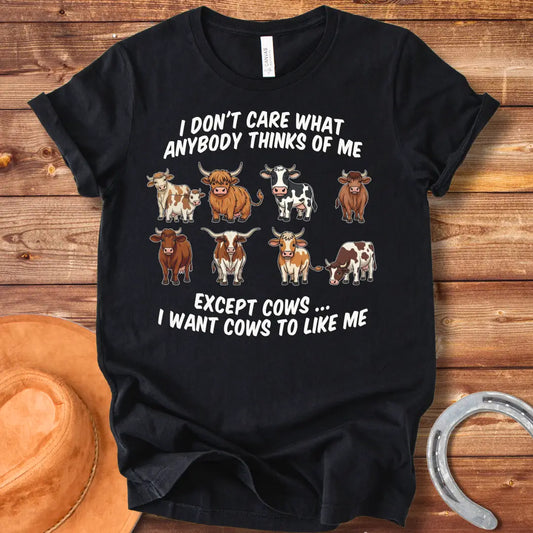 T-shirt design featuring multiple cartoon cow breeds with the phrase 'I Don't Care About Anybody Except Cows' on a black background.