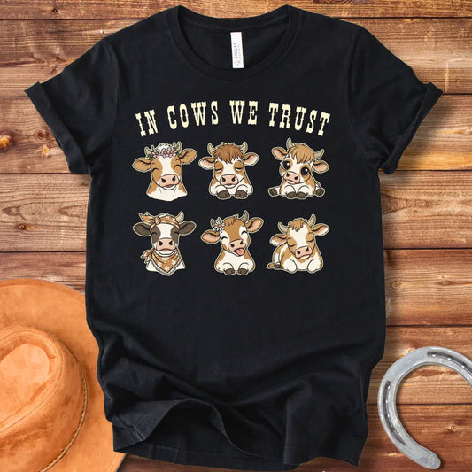 In Cows We Trust t-shirt featuring an illustration of six cute cows with different personalities.