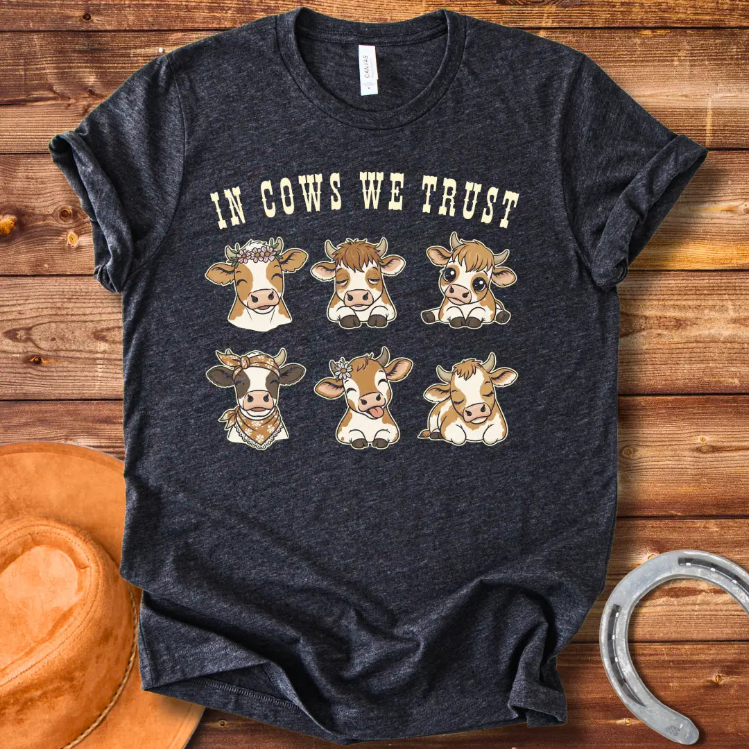 In Cows We Trust t-shirt featuring an illustration of six cute cows with different personalities.