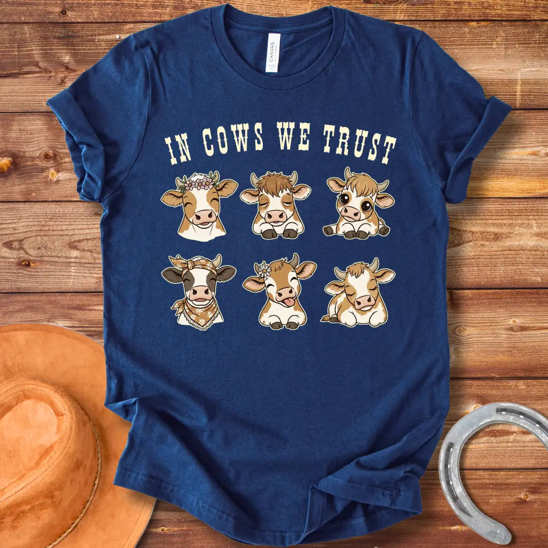 In Cows We Trust t-shirt featuring an illustration of six cute cows with different personalities.