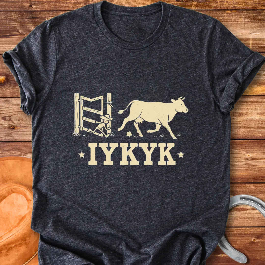 Silhouette of a cow running through an open gate with IYKYK text below.