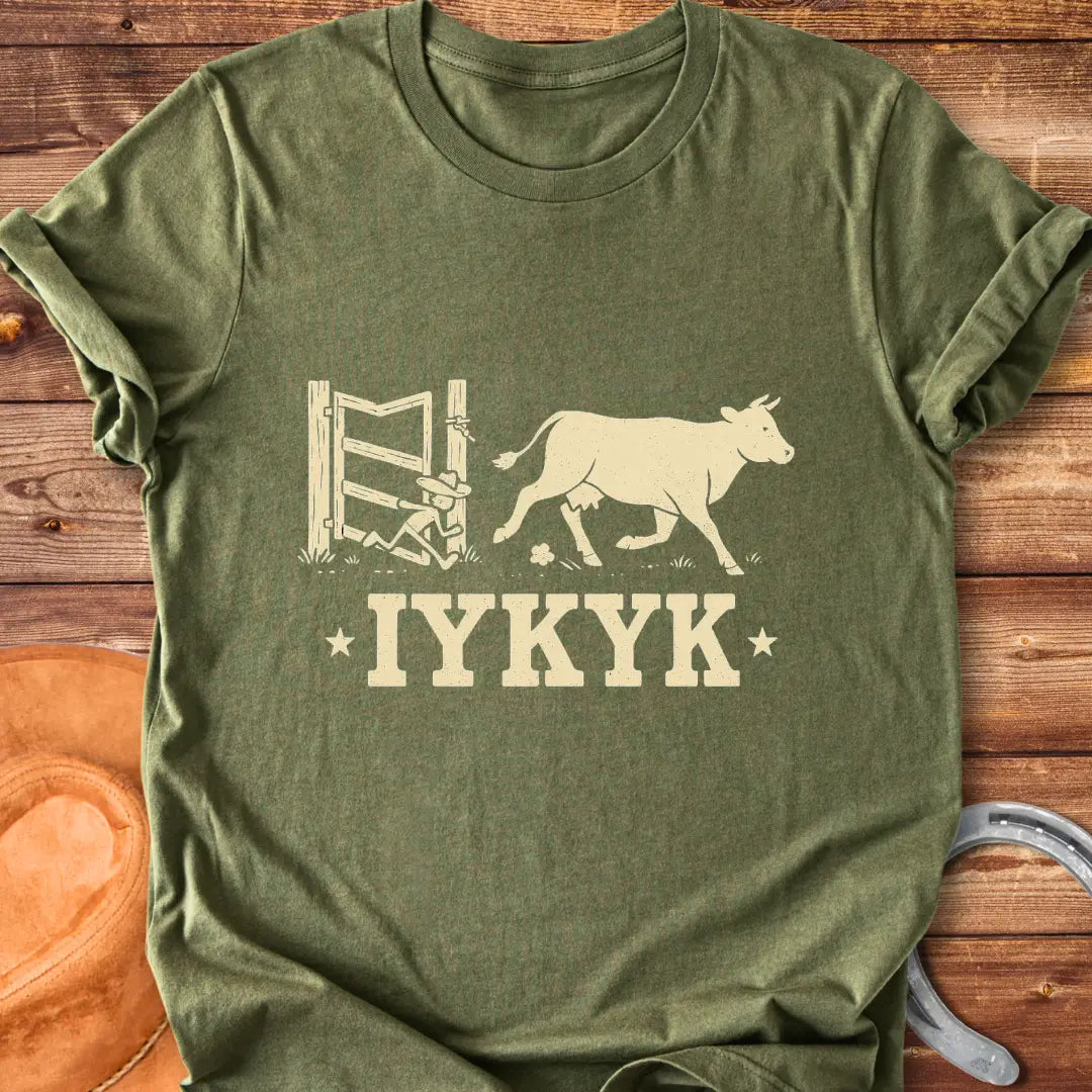 Silhouette of a cow running through an open gate with IYKYK text below.