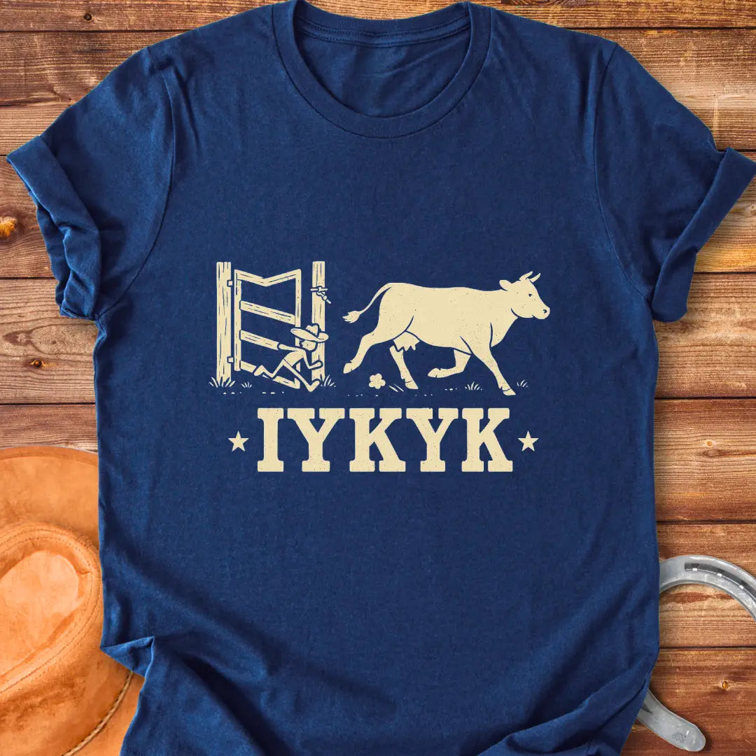 Silhouette of a cow running through an open gate with IYKYK text below.