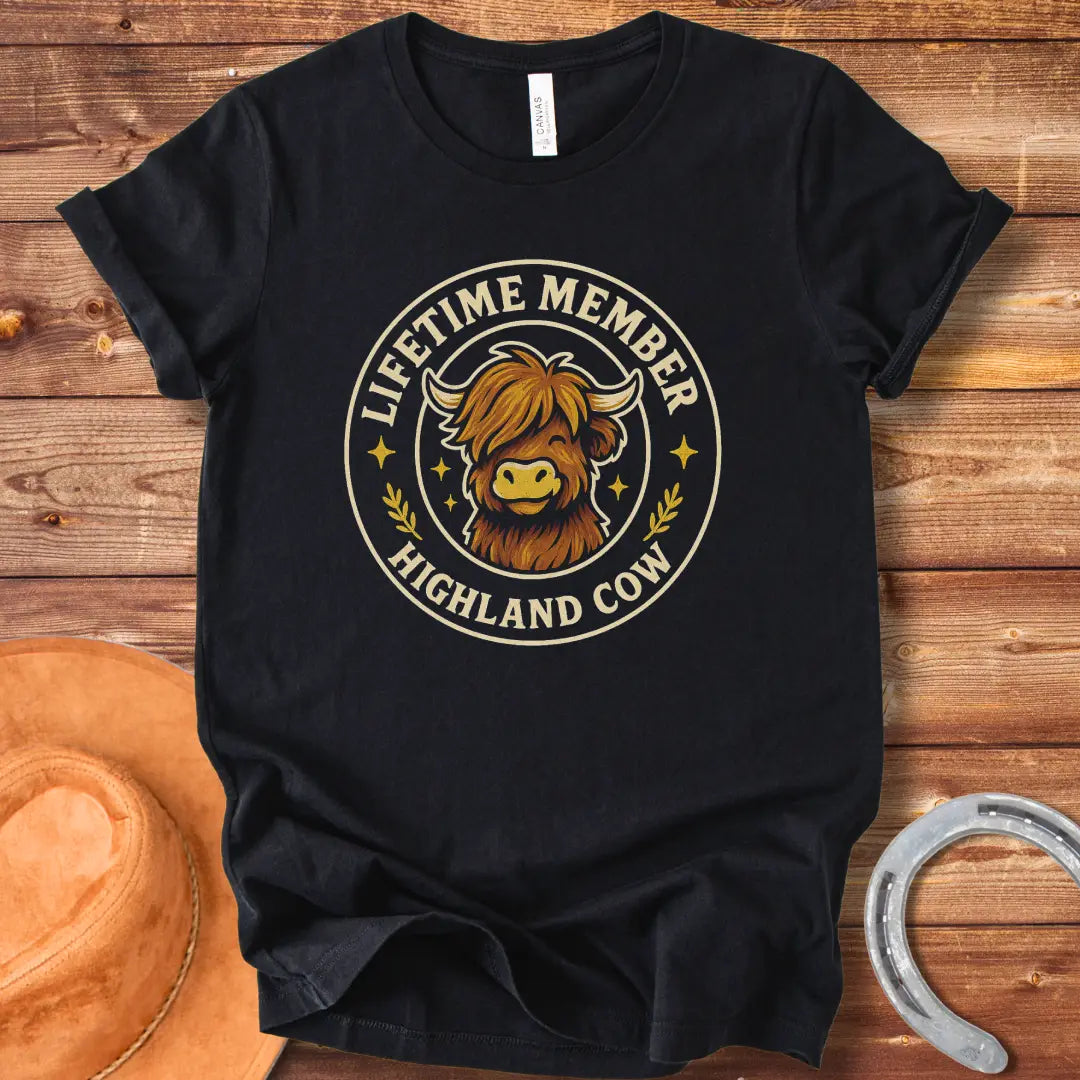 Lifetime Member Highland Cow T-Shirt design featuring a friendly and fluffy Highland cow face inside a circular badge.