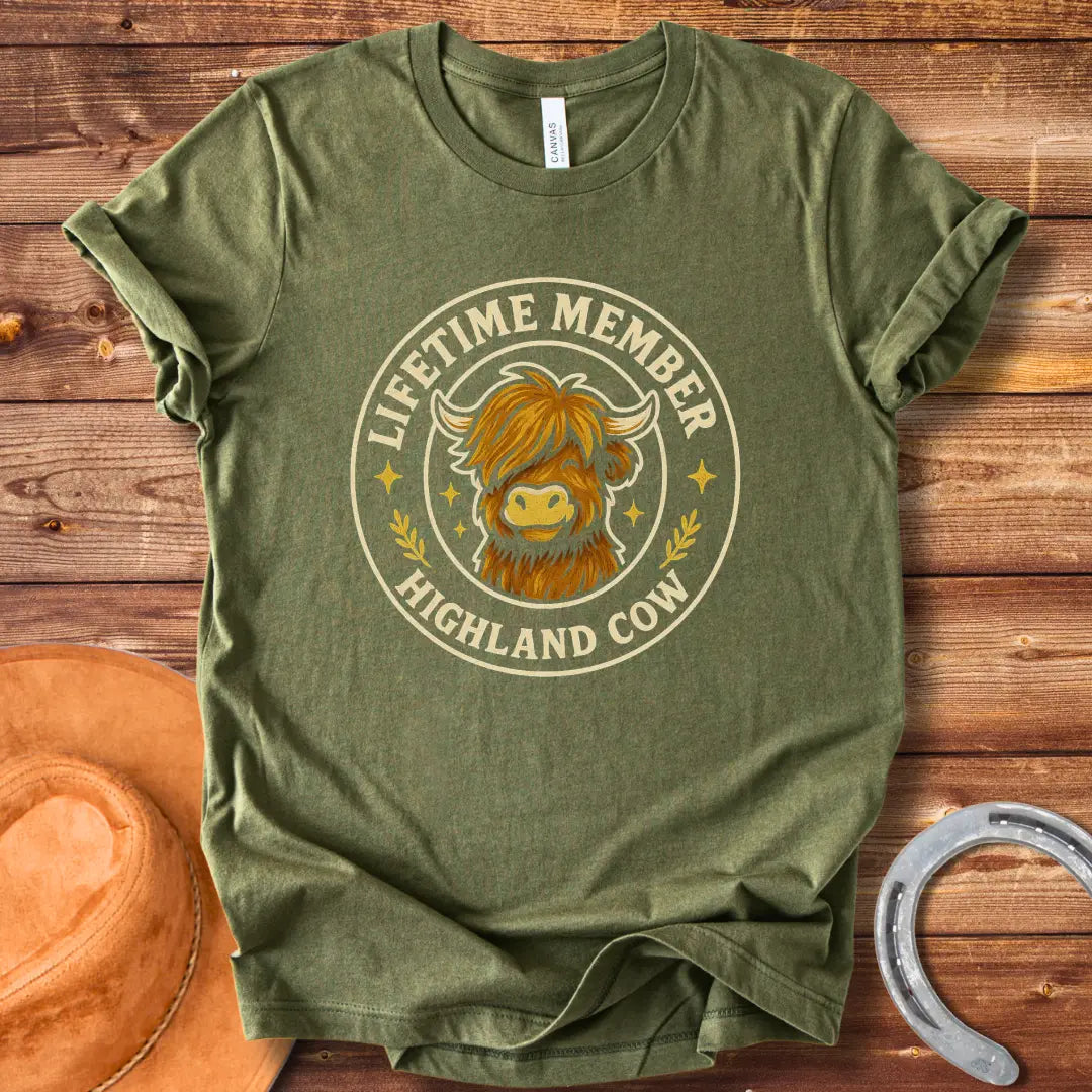 Lifetime Member Highland Cow T-Shirt design featuring a friendly and fluffy Highland cow face inside a circular badge.