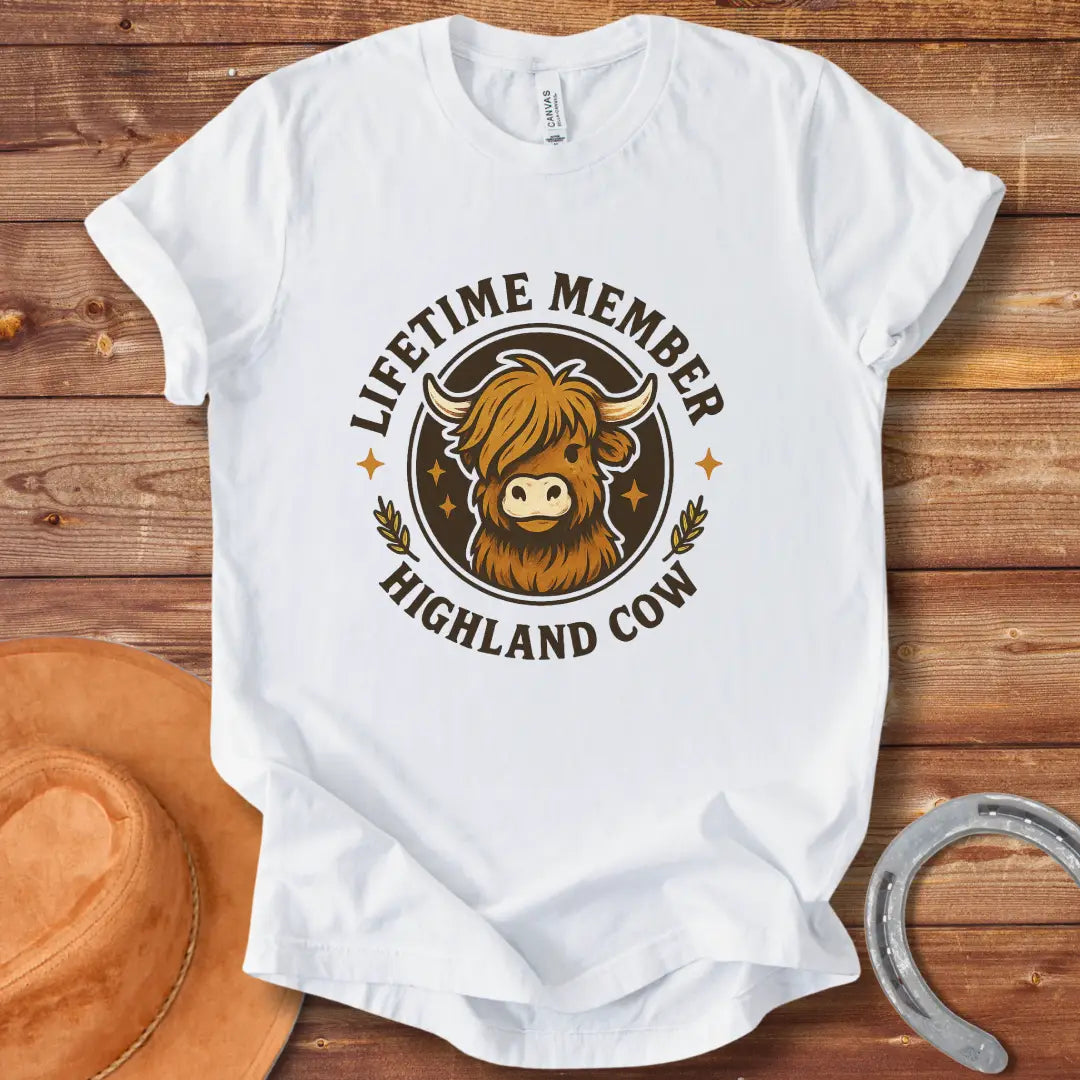 Lifetime Member Highland Cow T-Shirt design featuring a friendly and fluffy Highland cow face inside a circular badge.