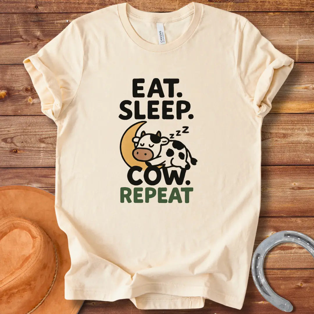 Line art illustration of a sleeping cow on a crescent moon with the text 'Eat Sleep Cow Repeat' 