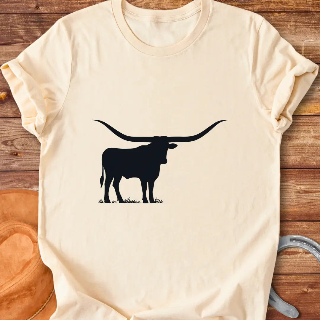 Silhouette of a longhorn on a prairie background, perfect for cow lovers.
