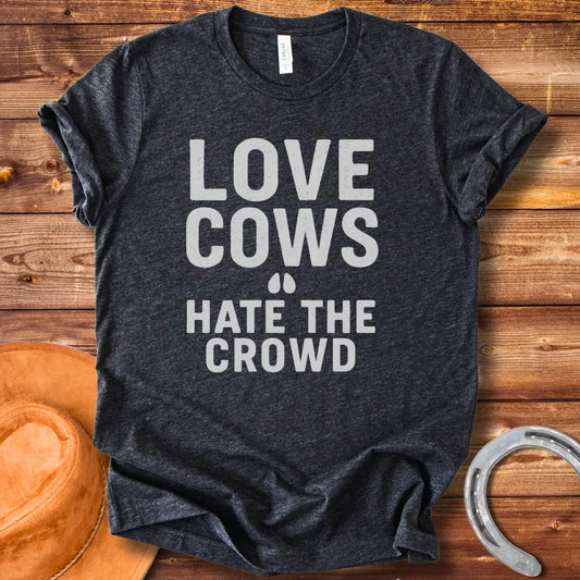 Black text on a black background reads, 'LOVE COWS' with two small hoof prints underneath and the words 'HATE THE CROWD' below.