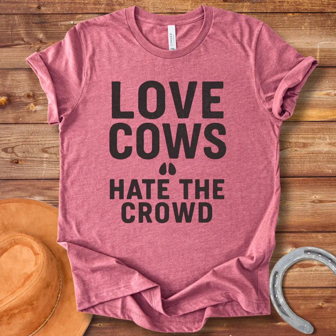 Black text on a black background reads, 'LOVE COWS' with two small hoof prints underneath and the words 'HATE THE CROWD' below.