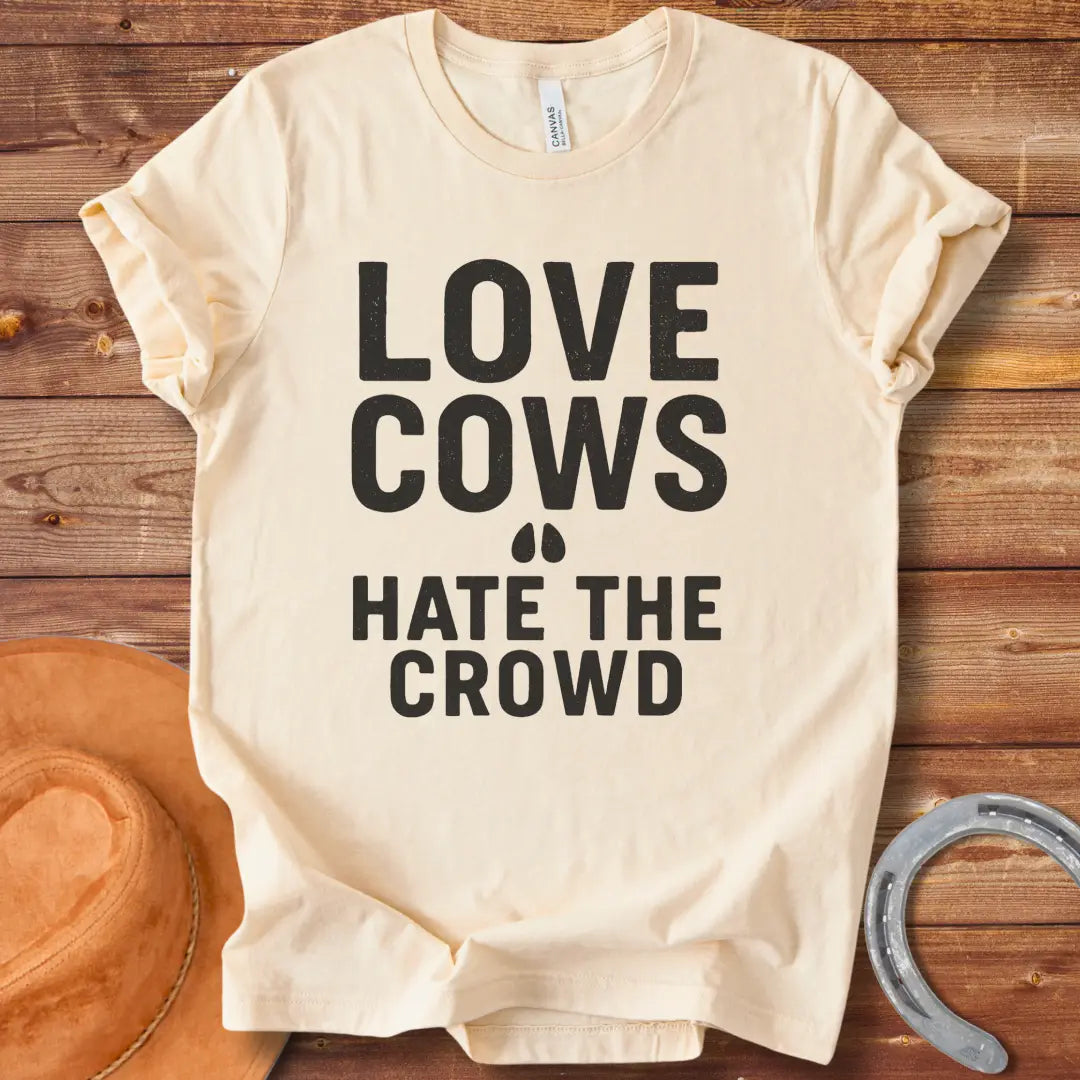 Black text on a black background reads, 'LOVE COWS' with two small hoof prints underneath and the words 'HATE THE CROWD' below.