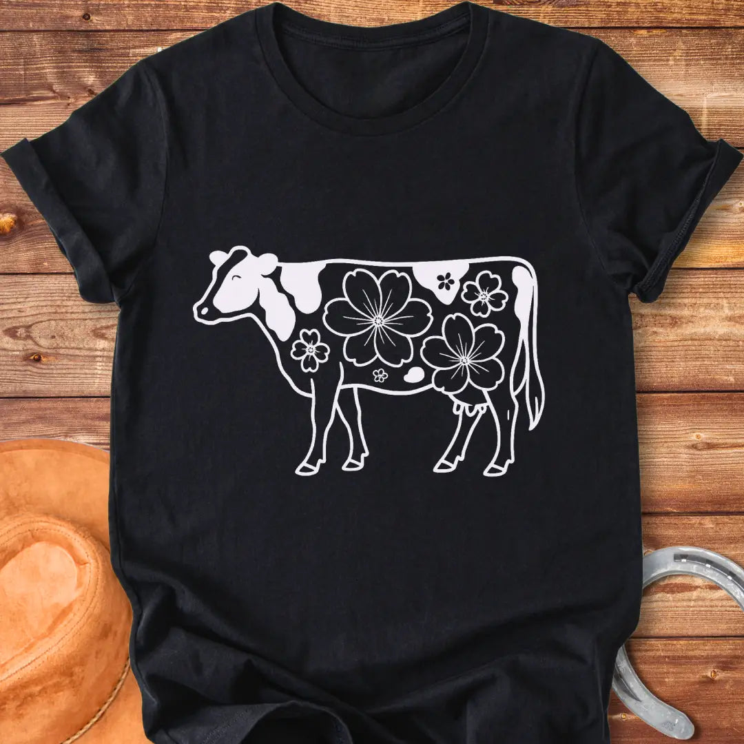 Magnolia Holstein T-Shirt featuring a Holstein cow silhouette with floral design