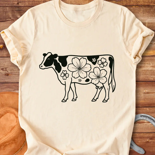 Magnolia Holstein T-Shirt featuring a Holstein cow silhouette with floral design