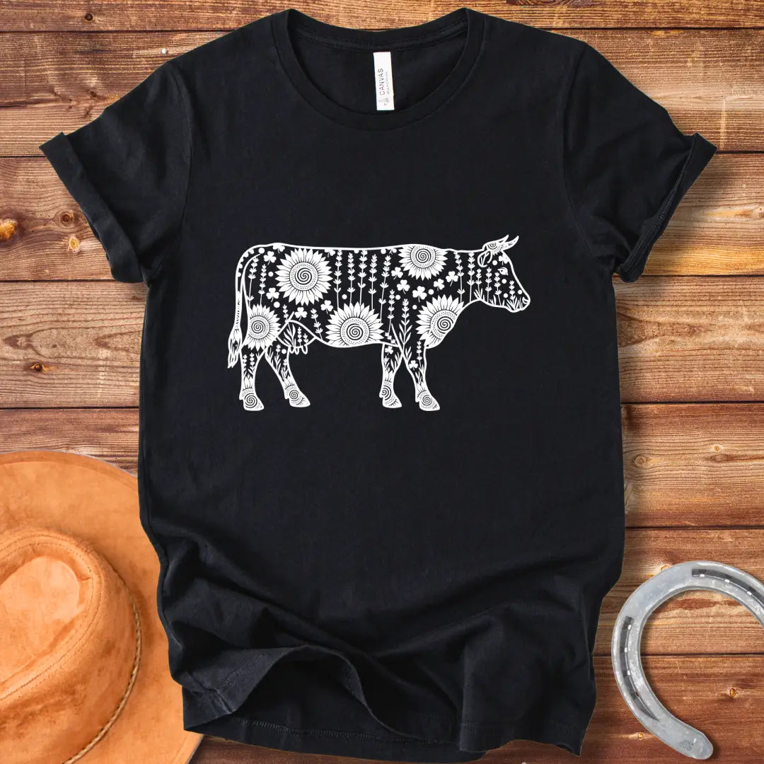 Mandala floral cow design on a t-shirt. The design features a cow silhouette filled with intricate floral patterns.