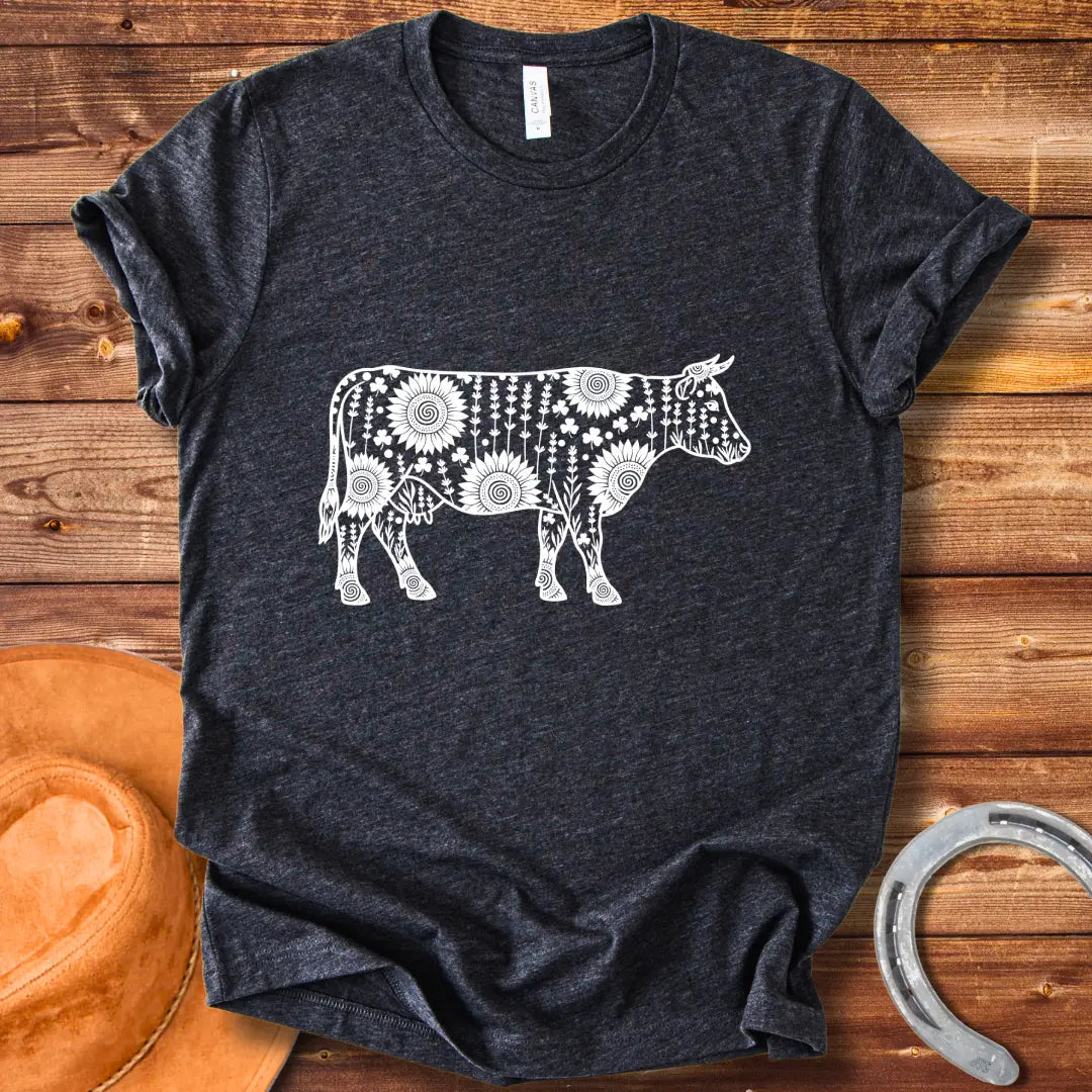 Mandala floral cow design on a t-shirt. The design features a cow silhouette filled with intricate floral patterns.