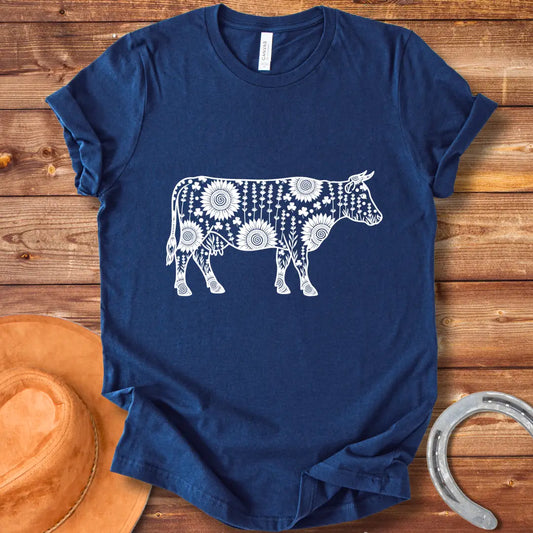Mandala floral cow design on a t-shirt. The design features a cow silhouette filled with intricate floral patterns.