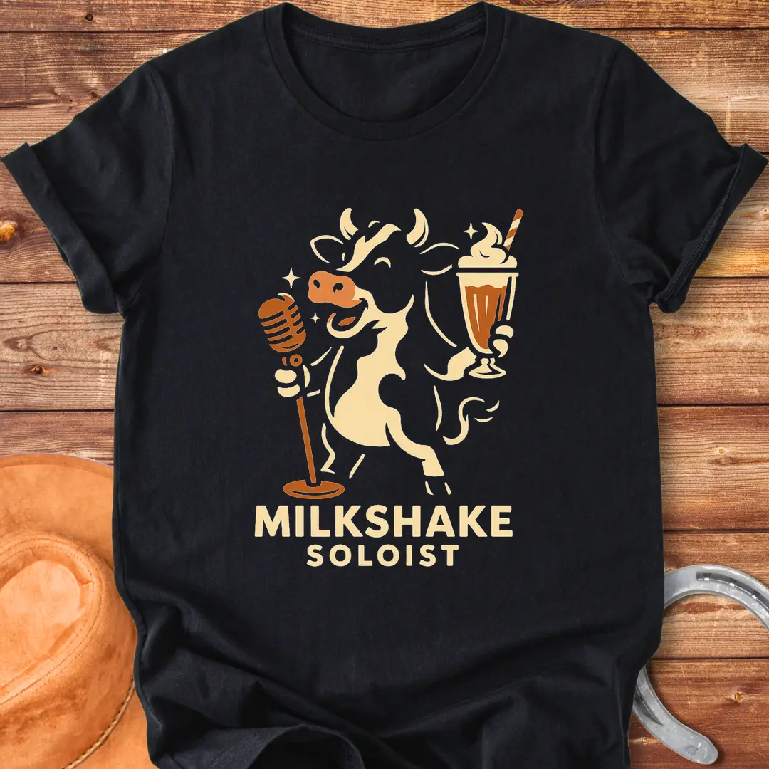 Milkshake Soloist T-Shirt featuring a cartoon cow holding a microphone and a milkshake with stars