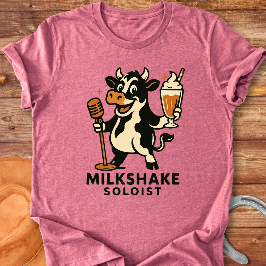 Milkshake Soloist T-Shirt featuring a cartoon cow holding a microphone and a milkshake with stars