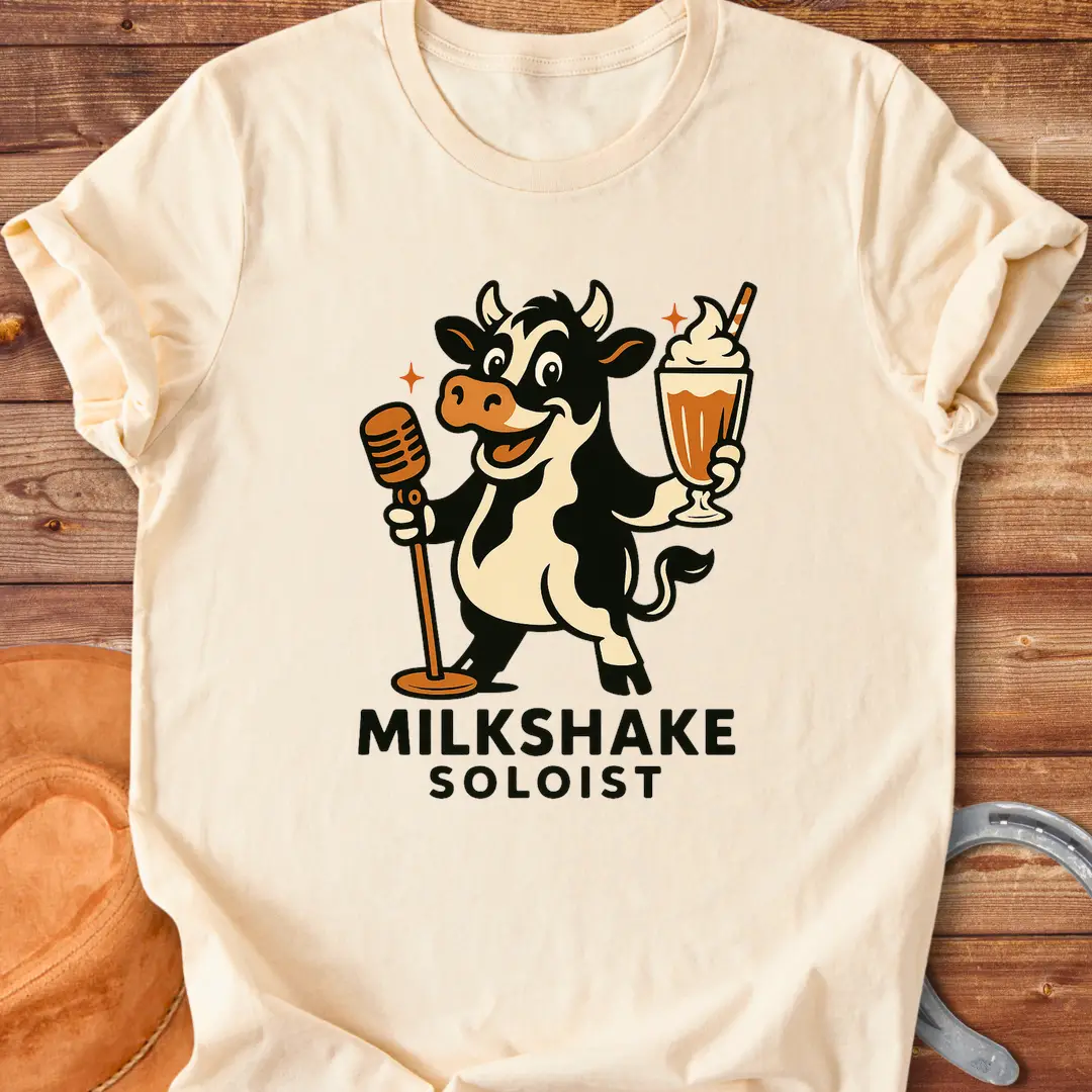 Milkshake Soloist T-Shirt featuring a cartoon cow holding a microphone and a milkshake with stars