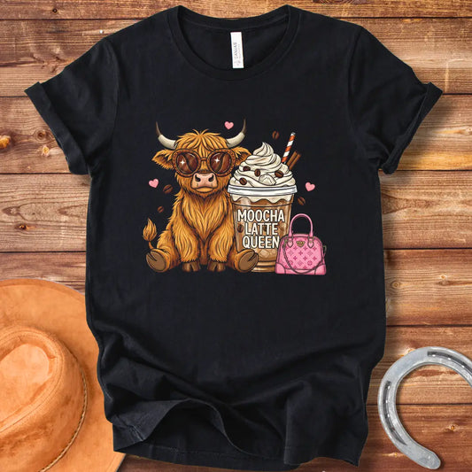 A cartoon image of a cute Highland cow wearing sunglasses, sitting next to a mocha latte and a pink purse that says 'Moocha Latte Queen' on it.