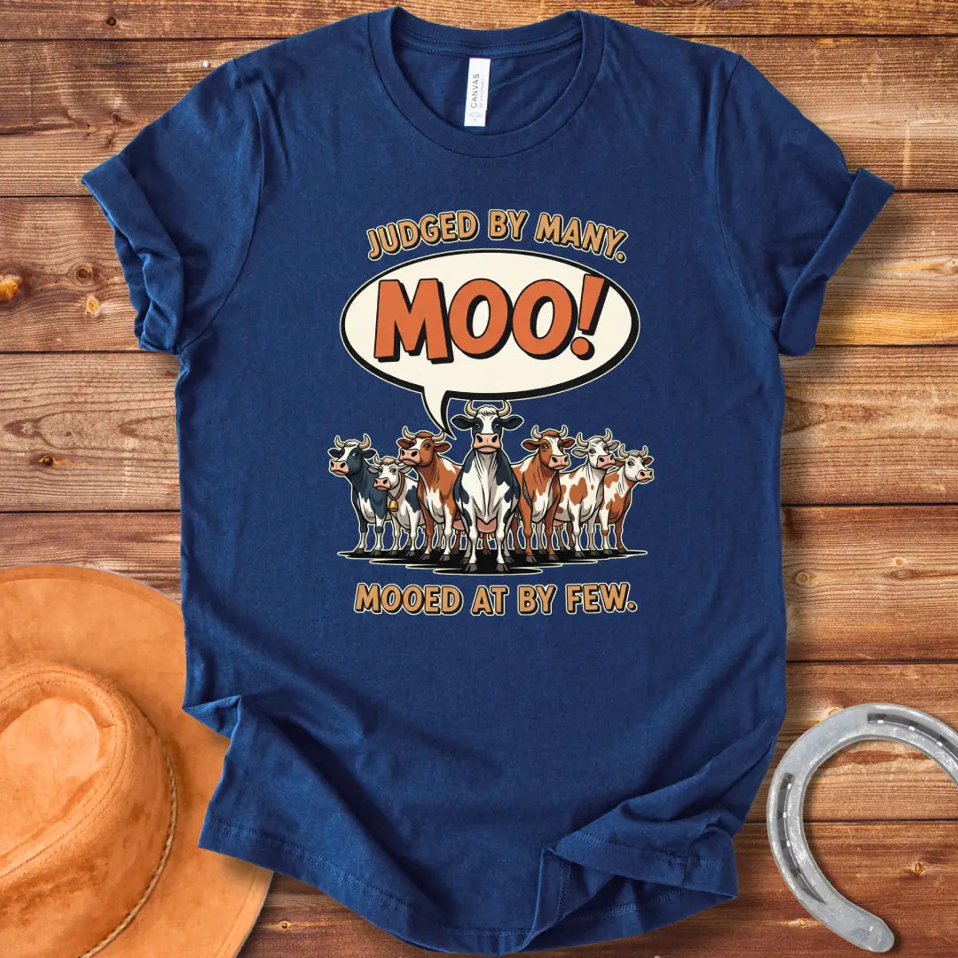 Moo-ed At By Few T-shirt featuring a group of cartoon cows with a speech bubble saying 'Moo!'