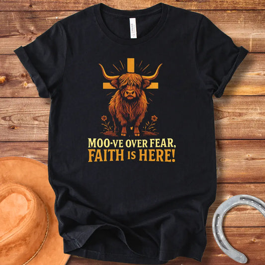 Cow standing in front of a wooden cross with the text 'Moo-ve Over Fear, Faith Is Here!'