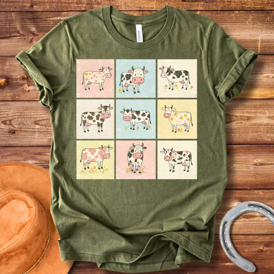 Moo-zaic T-Shirt featuring a mosaic of cute cartoon cows in a variety of colors and patterns, representing the different breeds with floral elements.