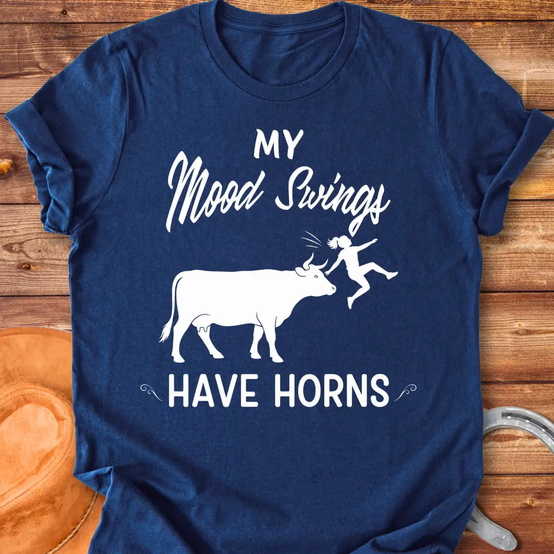 Funny t-shirt design with a cow and the words 'Mood Swings Have Horns'