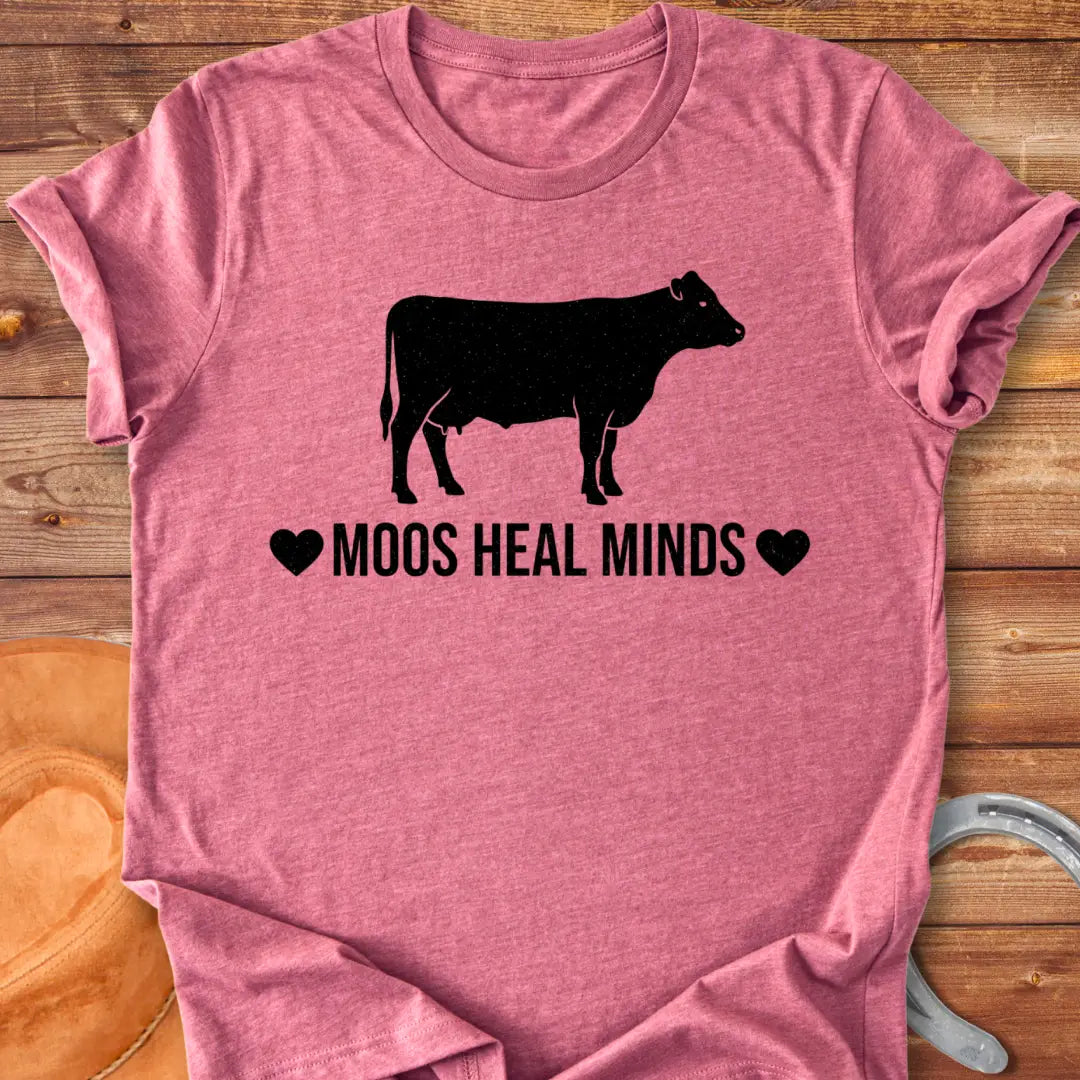 Moos Heal Minds T-shirt featuring a cow silhouette and the phrase 'Moos Heal Minds'