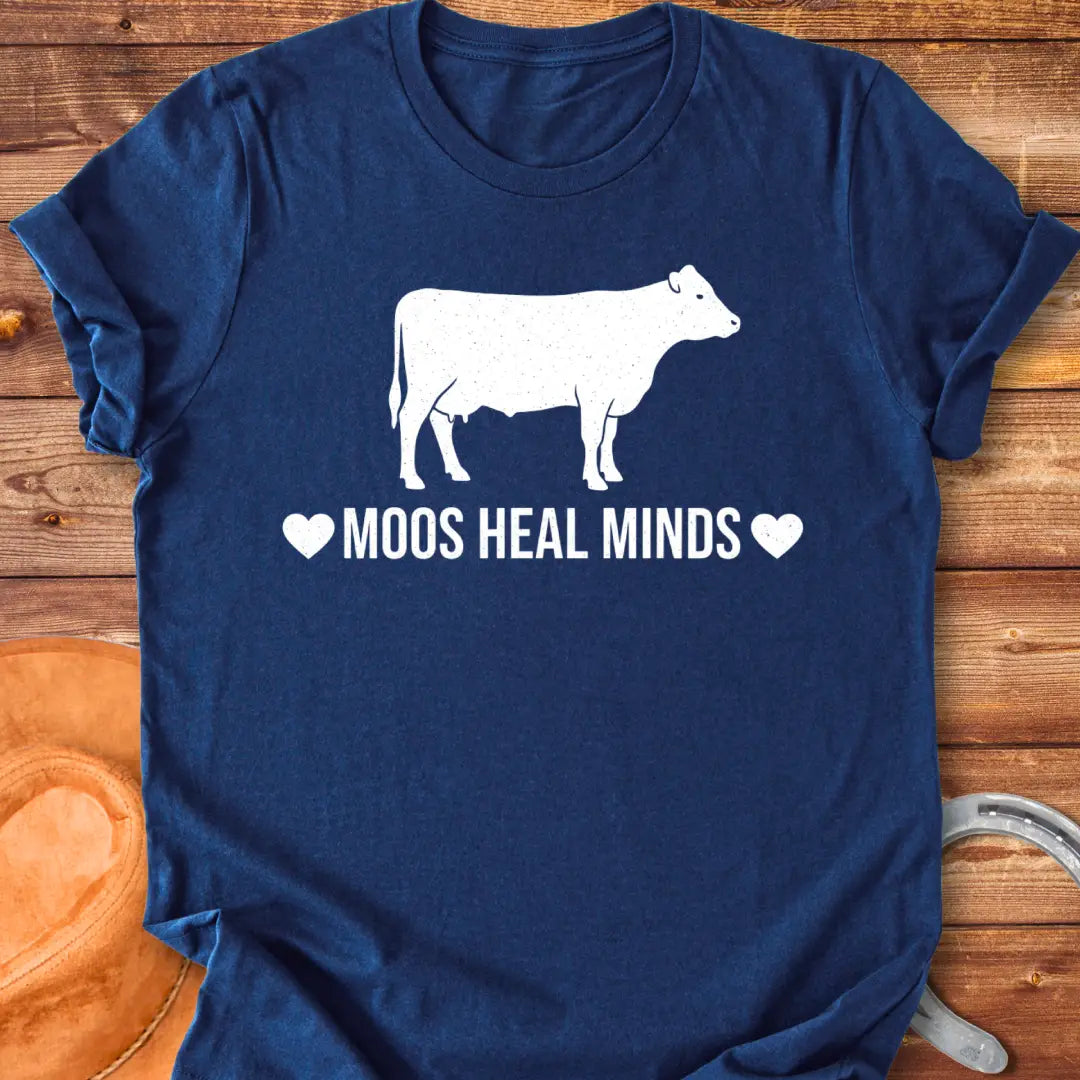 Moos Heal Minds T-shirt featuring a cow silhouette and the phrase 'Moos Heal Minds'