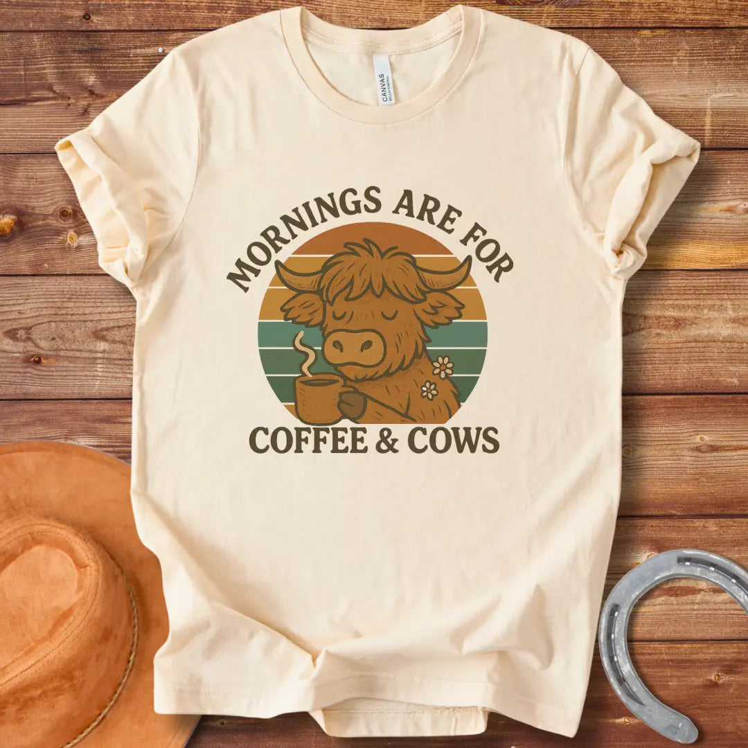 Illustration of a cow sipping coffee, with the words 'Mornings are for Coffee & Cows' in a retro design.
