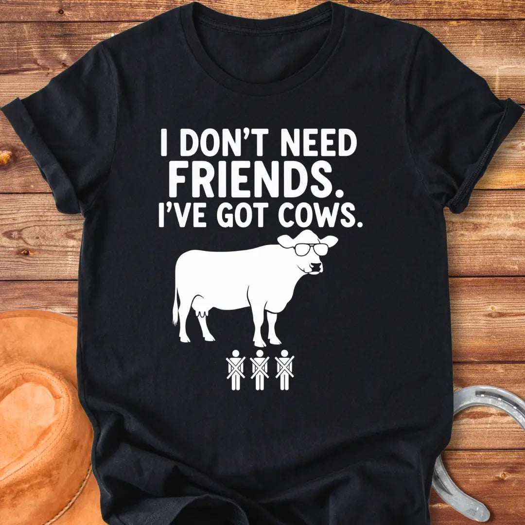 Black and white t-shirt with the text 'I don't need friends, I've got cows' and a cow wearing sunglasses and crossed out stick figures.