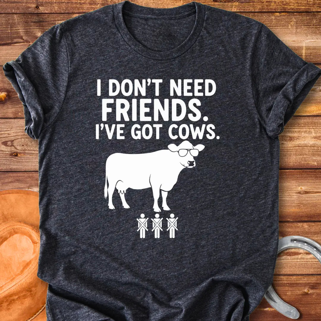 Black and white t-shirt with the text 'I don't need friends, I've got cows' and a cow wearing sunglasses and crossed out stick figures.