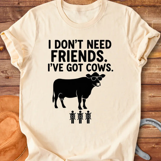 Black and white t-shirt with the text 'I don't need friends, I've got cows' and a cow wearing sunglasses and crossed out stick figures.