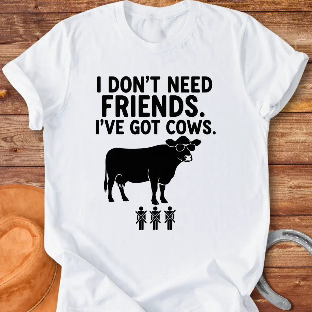 Black and white t-shirt with the text 'I don't need friends, I've got cows' and a cow wearing sunglasses and crossed out stick figures.