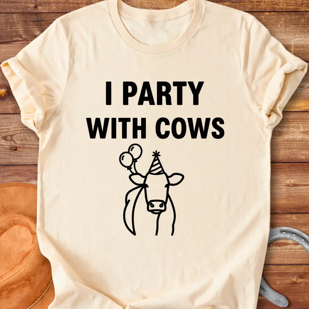 Party With Cows T-Shirt - Design features a cow wearing a party hat and holding balloons.