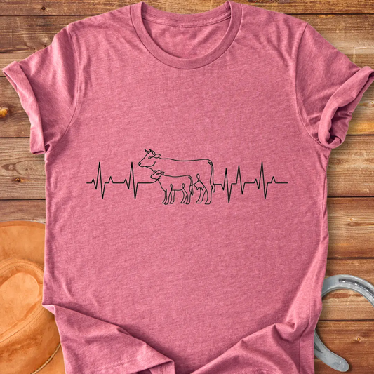 Pasture Heartbeat T-Shirt design featuring a cow and calf within a heartbeat graphic.