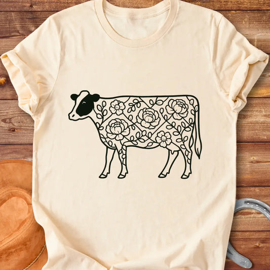 Silhouette of a holstein cow filled with peony flowers and eucalyptus leaves, in green outline.