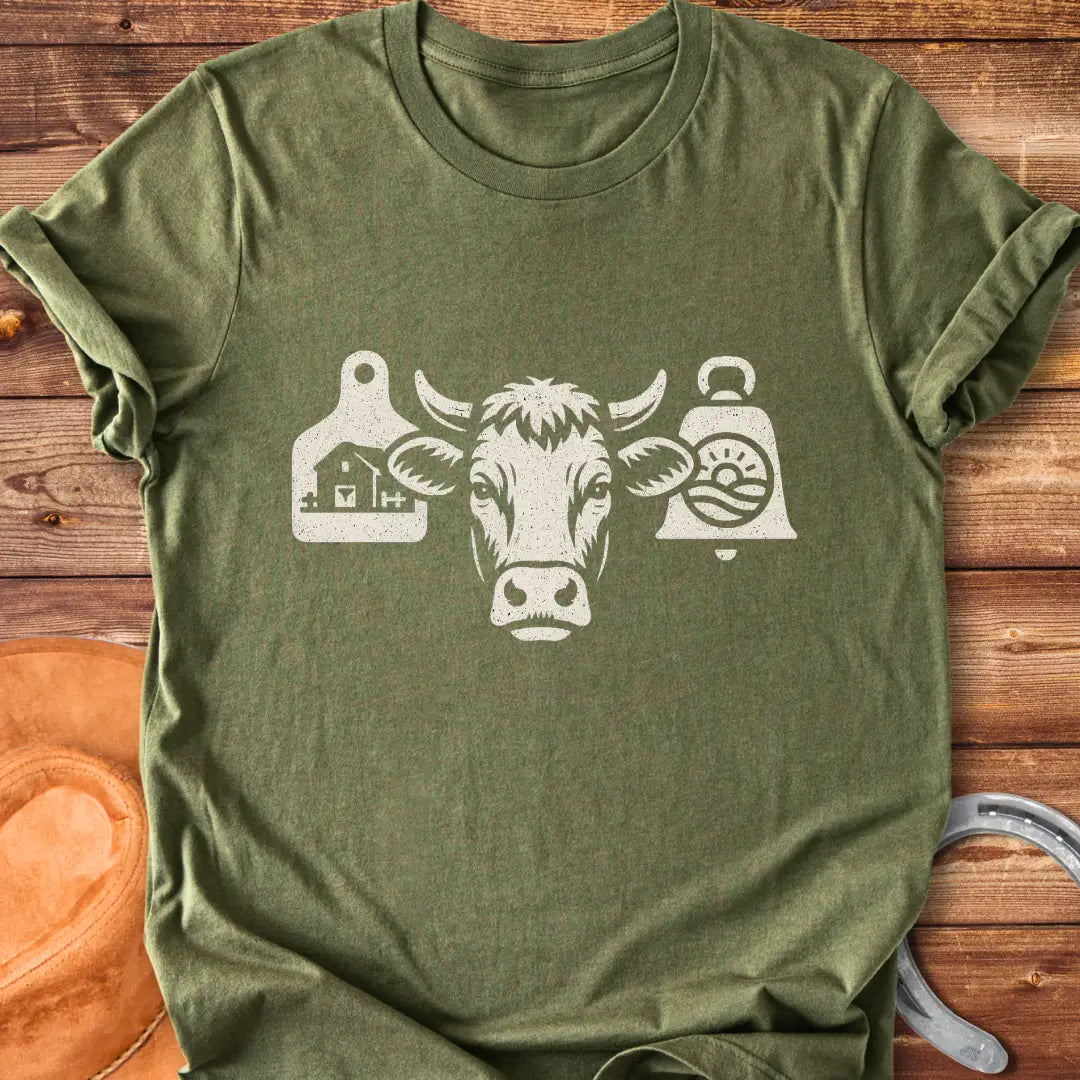 Black and white silhouette of a cow's head with bell tags, one showing a farm and the other with a landscape with sun
