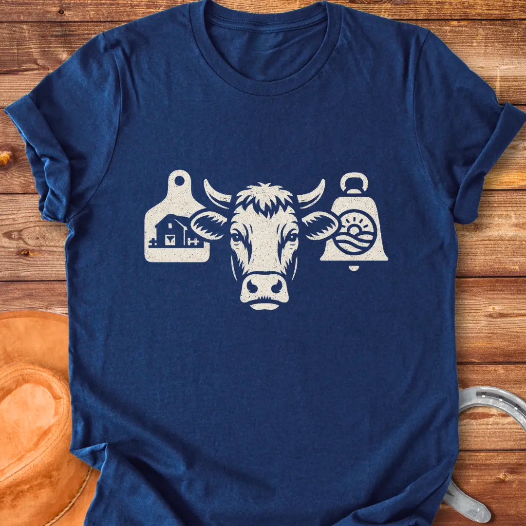Black and white silhouette of a cow's head with bell tags, one showing a farm and the other with a landscape with sun