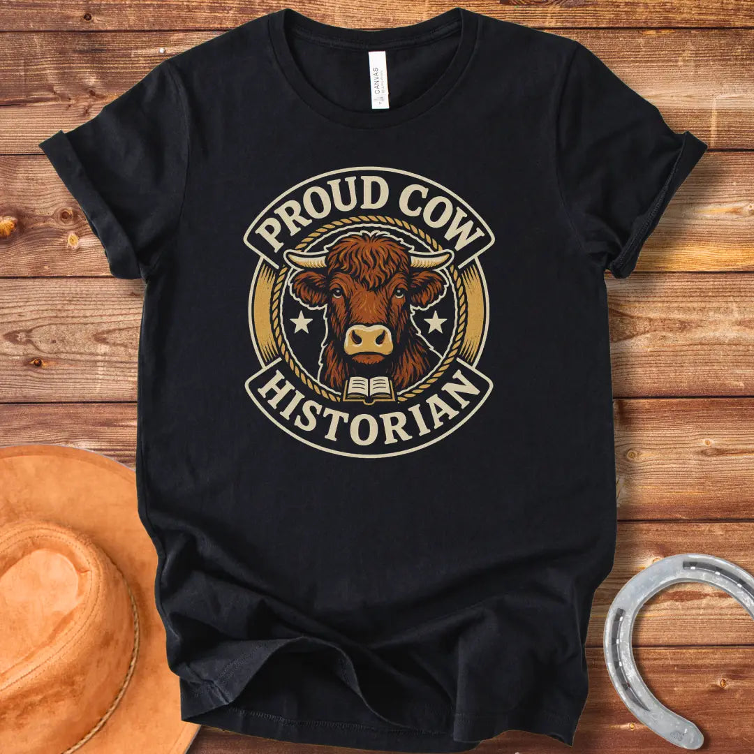 Proud Cow Historian T-Shirt featuring a highland cow, books, and stars.
