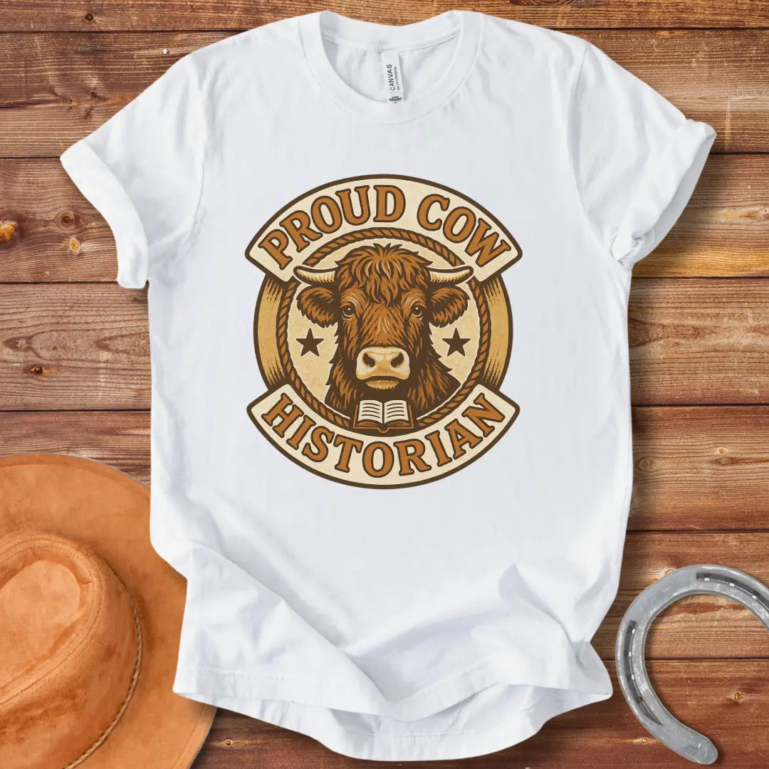 Proud Cow Historian T-Shirt featuring a highland cow, books, and stars.