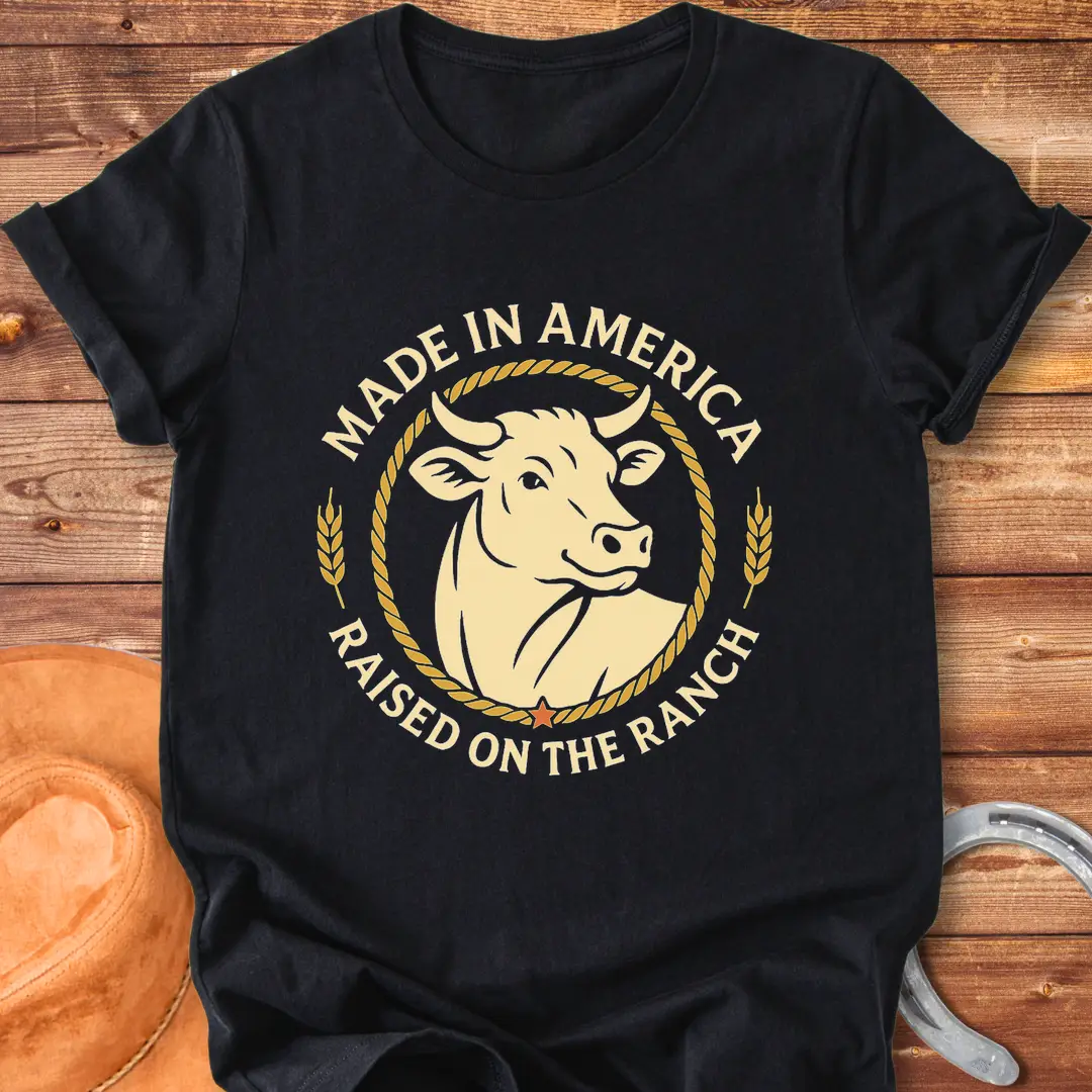 Raised on the Ranch t-shirt featuring a cow illustration and patriotic elements
