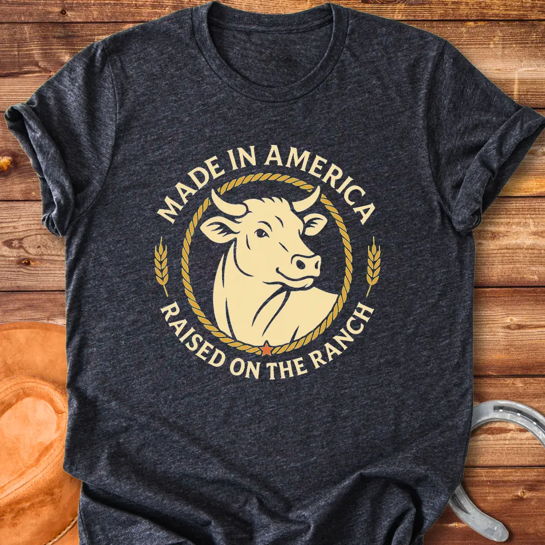Raised on the Ranch t-shirt featuring a cow illustration and patriotic elements
