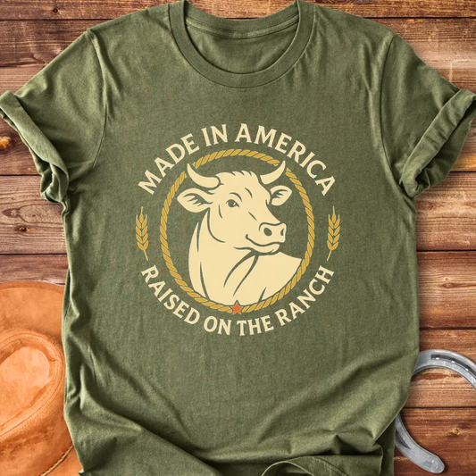 Raised on the Ranch t-shirt featuring a cow illustration and patriotic elements