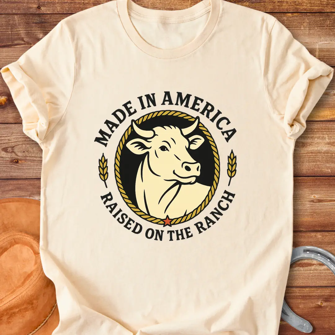 Raised on the Ranch t-shirt featuring a cow illustration and patriotic elements