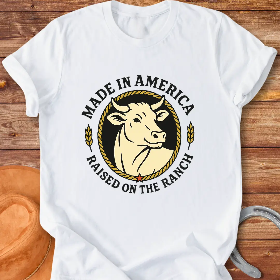 Raised on the Ranch t-shirt featuring a cow illustration and patriotic elements
