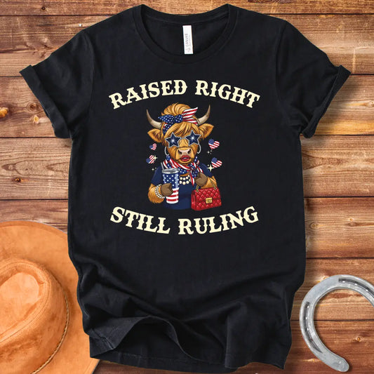 Stylish cow wearing star sunglasses and a patriotic scarf, holding a drink and purse, with the text 'Raised Right Still Ruling' above.