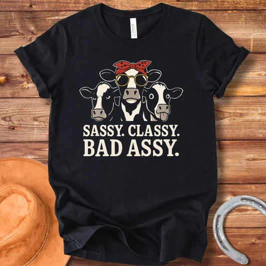 Illustration of three sassy cows wearing sunglasses and bandanas with the words 'Sassy Classy Bad Assy' below.