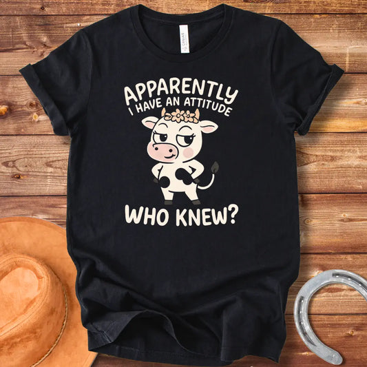 Illustration of a sassy cow wearing a floral crown and winking, with the words 'Apparently I Have An Attitude. Who Knew?'